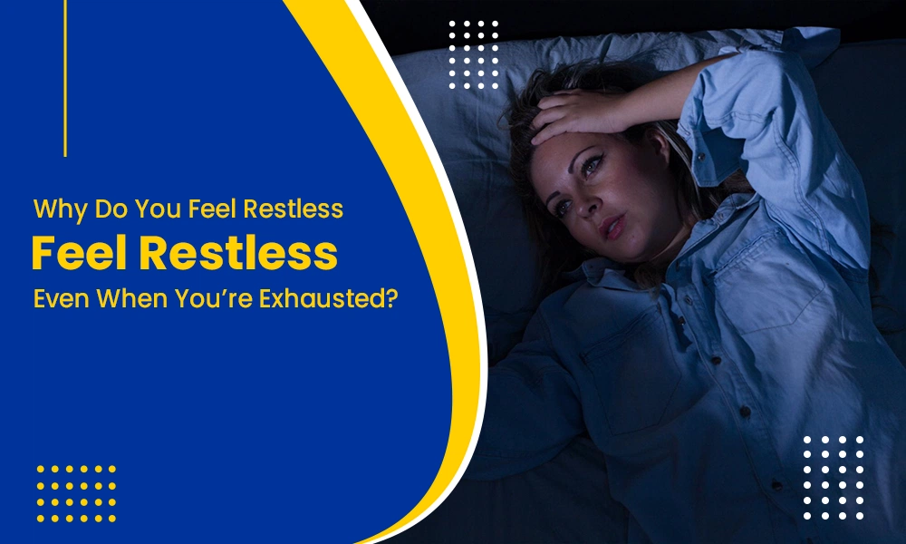 A woman lying awake in bed feeling restless even when exhausted.